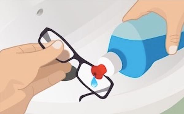 Illustration of the application of a drop of dishwashing liquid on prescription glasses.