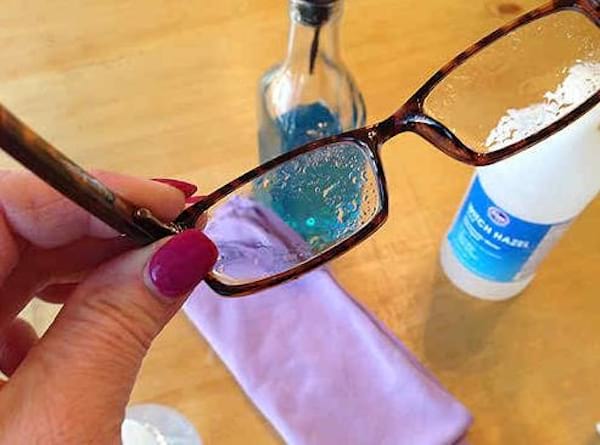 Glasses with a cleaning spray on the glasses.
