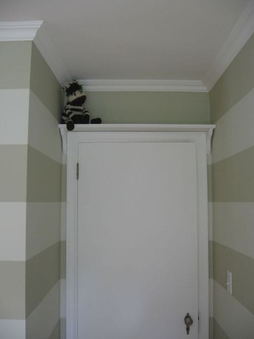 a shelf installed above the door saves space
