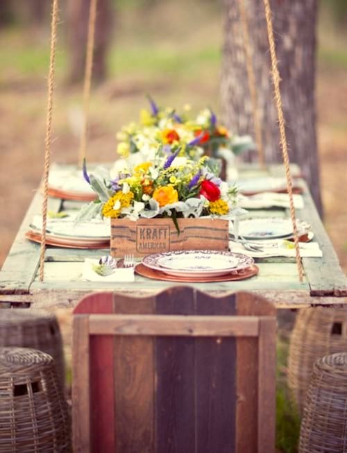 Upcycling idea: an old door recycled into a hanging table for a picnic in the garden.