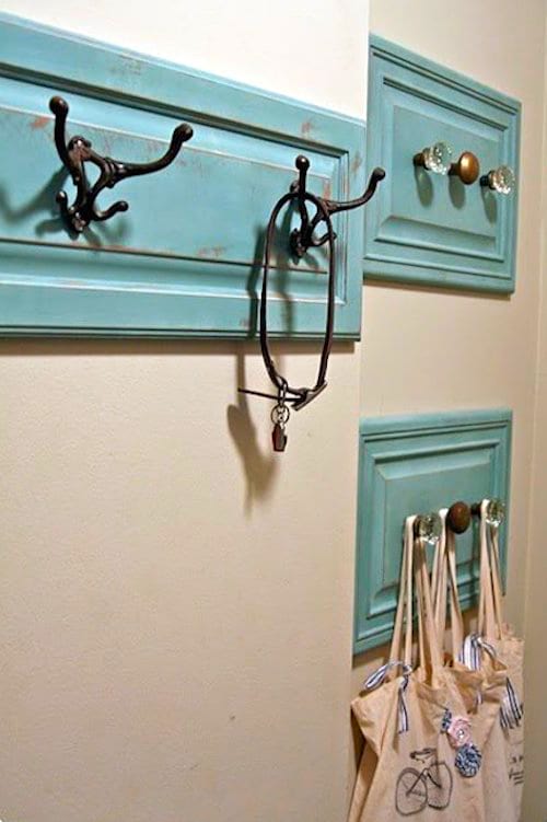 Upcycling idea: old doors recycled into coat hooks to hang your bags.