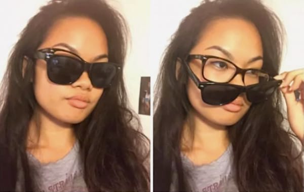 Une jeune femme avec des lunettes de soleil qui cachent des lunettes de vue.