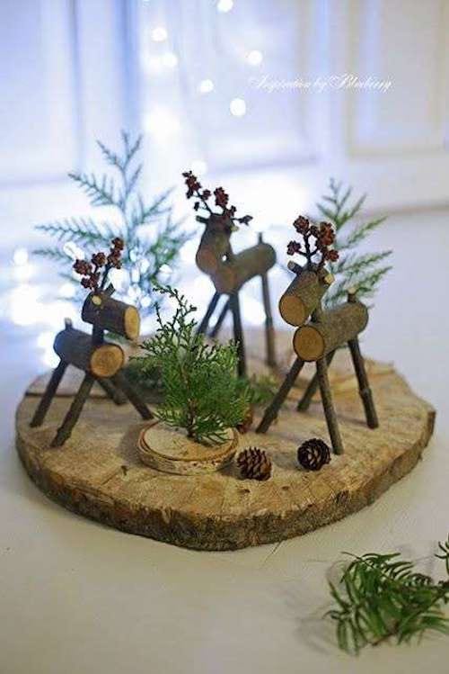 Three little reindeer on a wooden log 