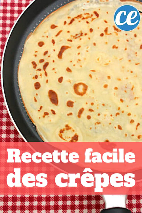 Une crêpe sans temps de repos en train de cuir dans une poêle sur une nappe à carreaux rouge