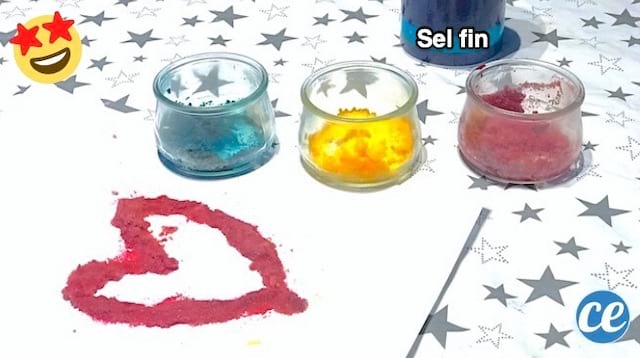 Des pots de peinture au sel sur une table pour faire une activité manuelle