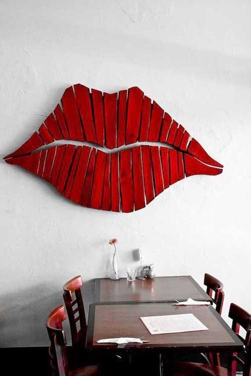 Huge lips with lipstick on a wall 