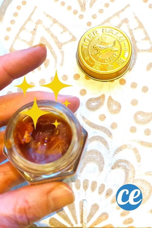Un pot ouvert de baume du tigre