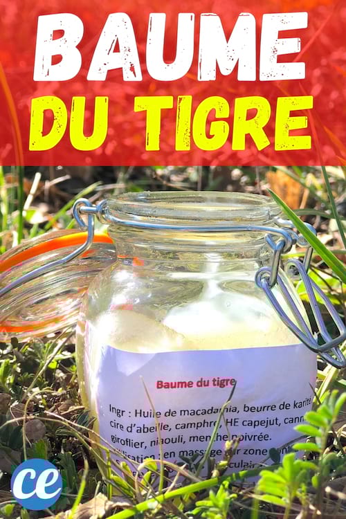 un flacon de baume du tigre fait maison dans l'herbe 100% naturel