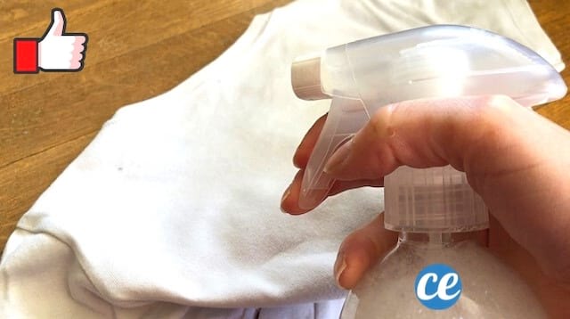 Un flacon de détachant maison avec du percabonate et un tshirt blanc