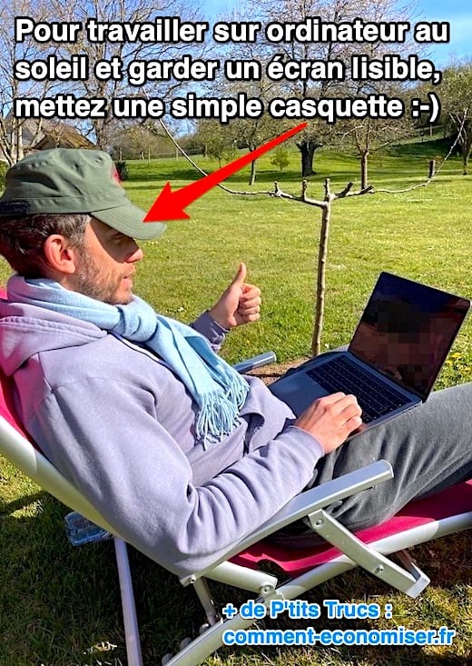 Une homme qui travaille au soleil sur son ordinateur sans problème de lisibilité