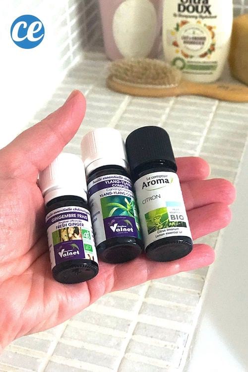 des huiles essentielles de citron, gingembre et ylang ylang et du shampoing pour faire un soin anti chute de cheveux