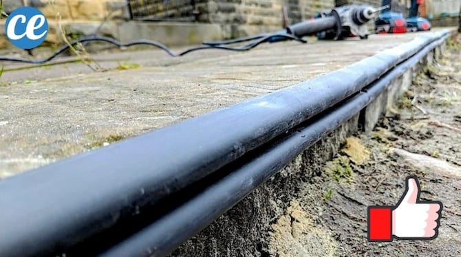 Un caoutchouc sur le trottoir pour prot&eacute;ger les roues de ma voiture en me garant