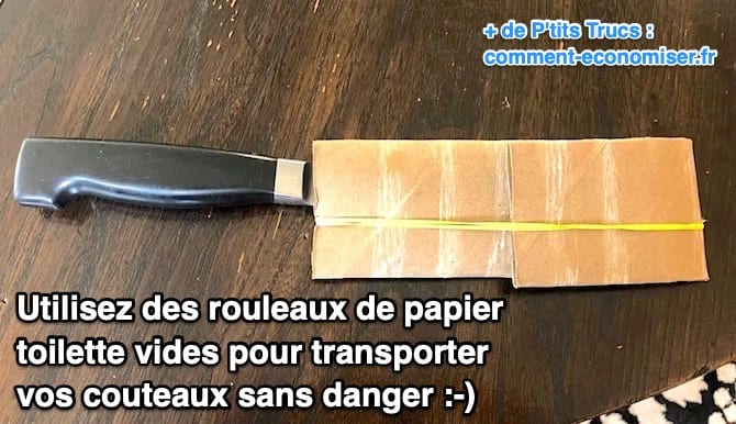 Un grand couteau de cuisine avec des rouleaux de papier toilette dessus pour protéger la lame