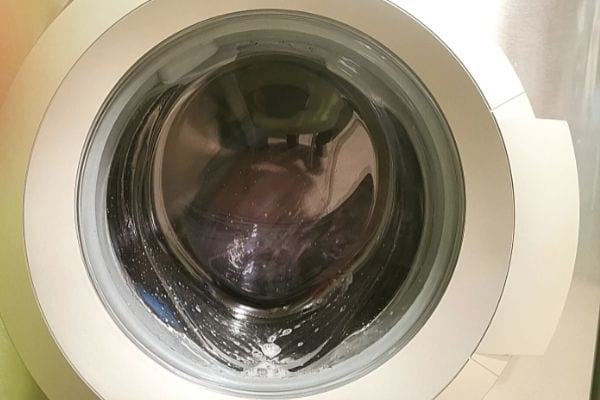 Washing machine porthole with laundry inside