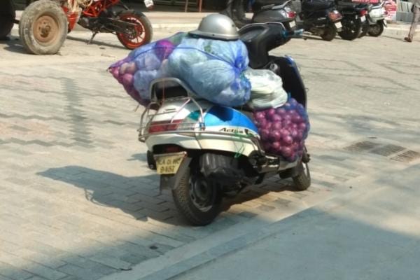 A heavily loaded scooter that consumes a lot of fuel