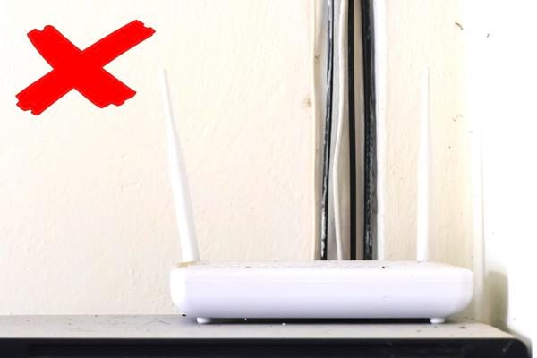 A wifi router placed in a corner of the house