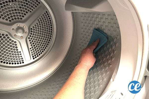 A person wiping through a clothes dryer 