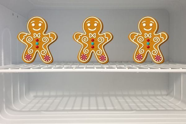 Three small cookies with gingerbread in a freezer 