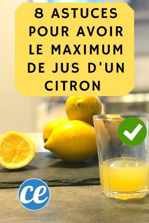 un verre de jus de citron et des citrons