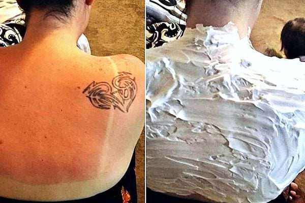 Une dame recouverte de mousse à raser sur son dos avec un tatouage en forme de coeur 