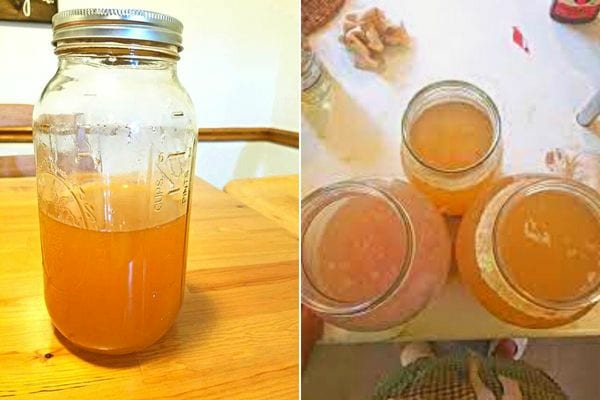 Trois bocaux de verre qui sont remplis de vinaigre de cidre fait-maison