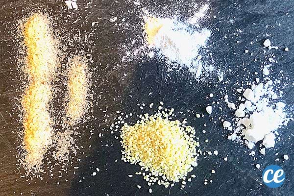Plusieurs poudres différentes qui son étalées sur une table en fonte
