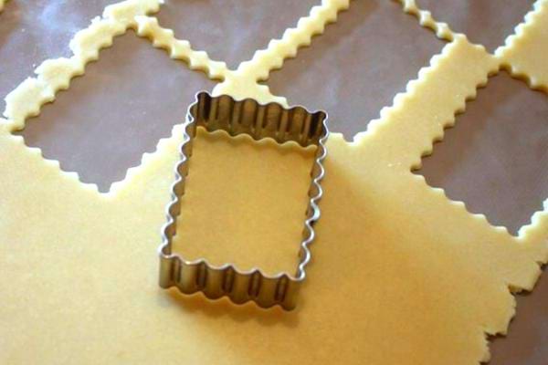 A special small butter cookie cutter on homemade dough
