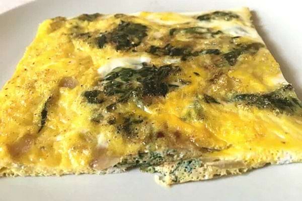 A square-shaped nettle omelet on a plate