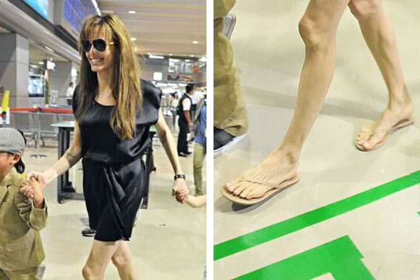Les pieds d'Angelina jolie dans des tongs