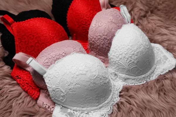 white, pink, red and black lace bras