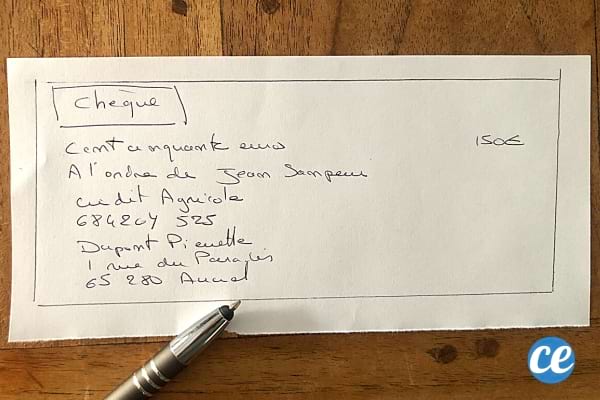 Nom et adresse écrit sur un chèque en papier libre