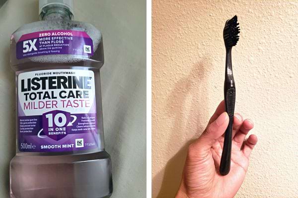 Une bouteille de listerine avec une brosse à dents noire
