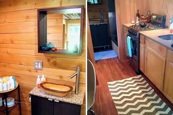 Vue de la cuisine avec plans de travail en bois et salle de bain avec vasque en verre.