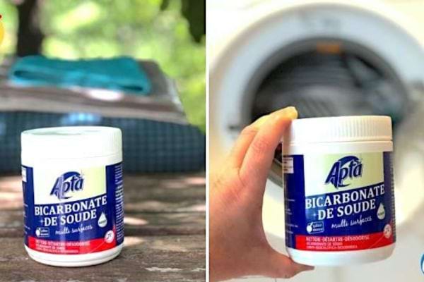 Pot de bicarbonate de soude "Apta" sur une table, avec une machine à laver à l'arrière-plan.