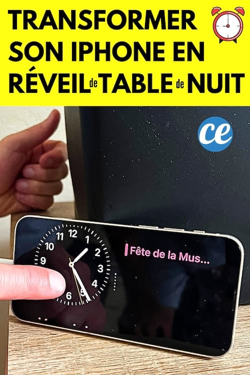 Un iphone mis en mode veille pour le transformer en réveil de table de nuit