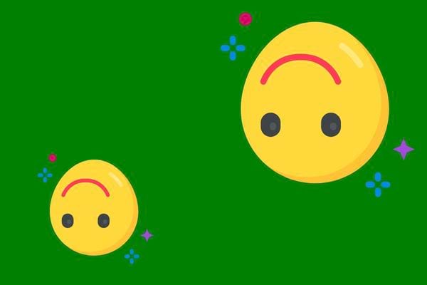 Deux smileys à l'envers sur fond vert avec étoiles.