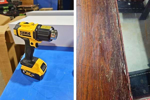 Décapeur thermique prêt à l'emploi sur une surface en bois.