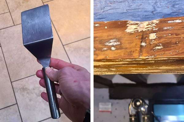 Spatule en métal et bois écaillé prêt à être gratté.