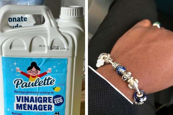 Bouteille de vinaigre ménager et poignet avec un bracelet Pandora.