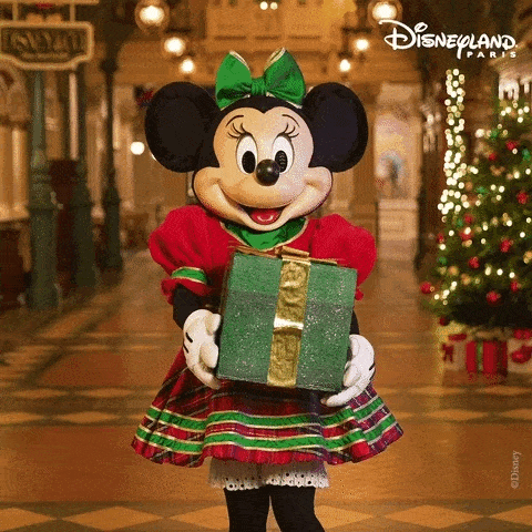 Minnie mouse tenant un cadeau de Noel gif