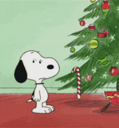 Snoopy prend un sucre d'orge sur un sapin