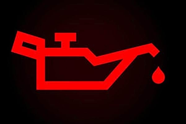 Symbole lumineux rouge d'alerte d'huile.