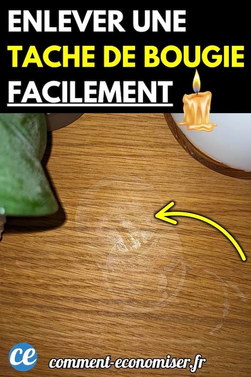 Tache de cire de bougie blanche sur une surface en bois clair.