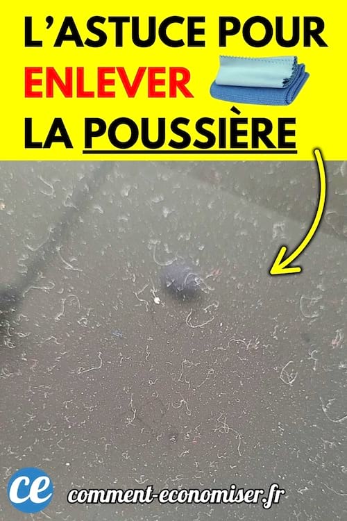 Surface noire couverte d'une accumulation de poussière et de petites fibres.