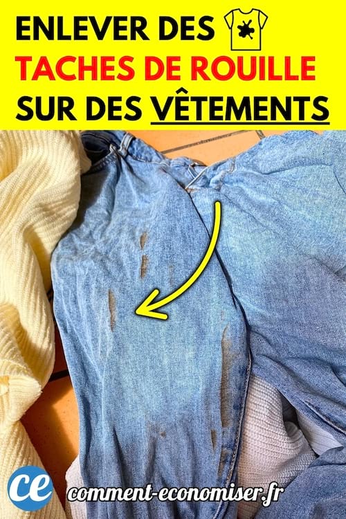  Jean bleu avec plusieurs taches de rouille bien visibles. 