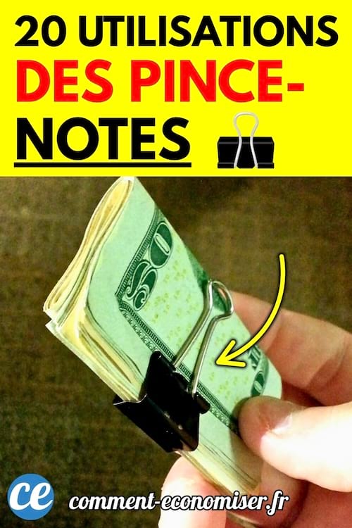 Main tenant une liasse de billets maintenue par une pince-notes noire.