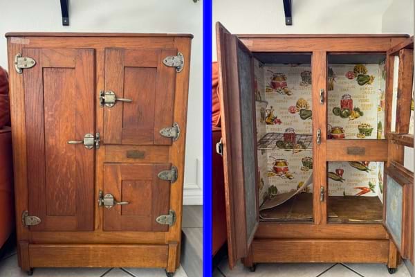 Ancien garde-manger en bois avec portes métalliques, utilisé avant les réfrigérateurs modernes.
