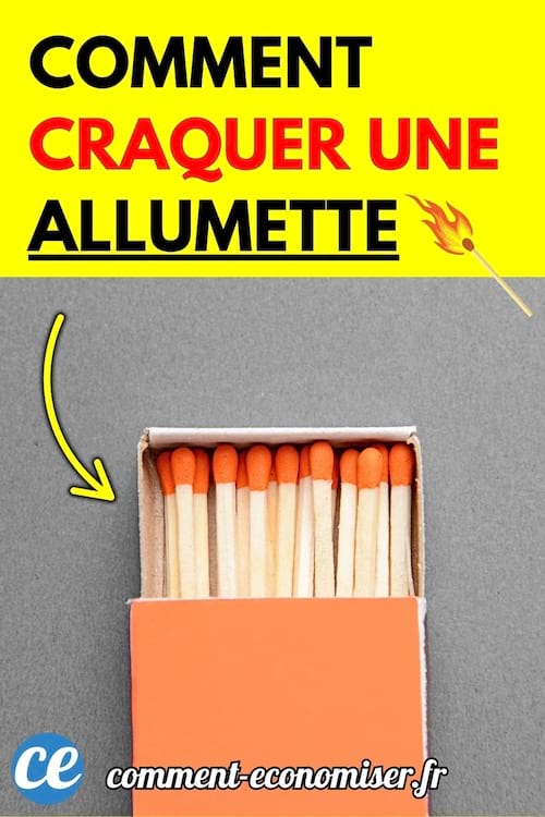 Une boîte d’allumettes ouverte avec des têtes rouges alignées, posée sur une surface grise.