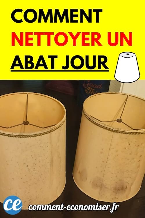 Deux abat-jours cylindriques jaunis posés sur une table foncée.