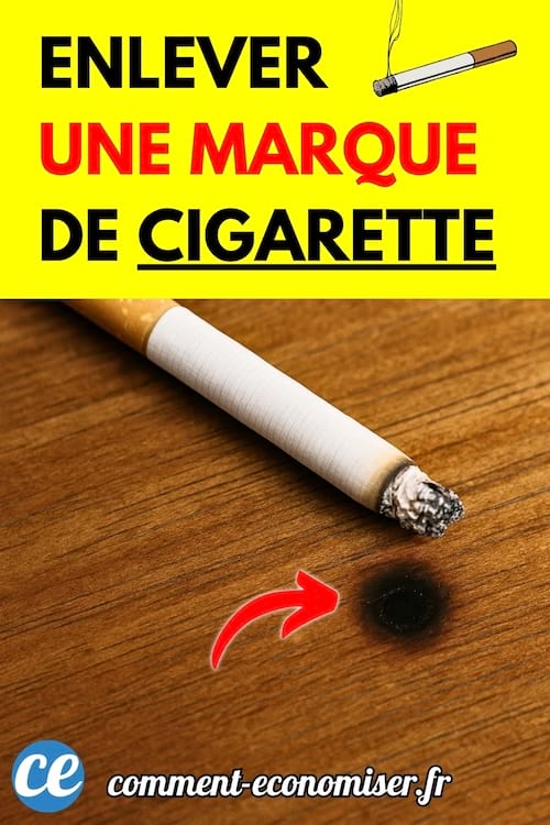 Une cigarette allumée posée sur une table en bois avec une trace noire de brûlure.